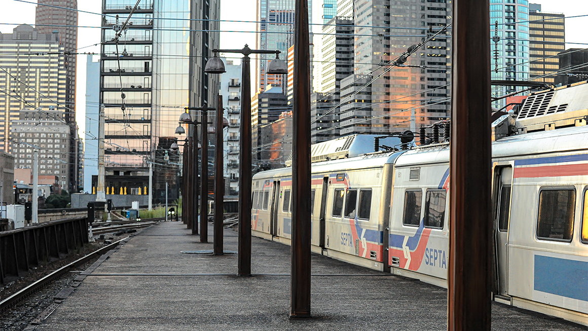 An aboveground train in Philadelphia idles outside the city.