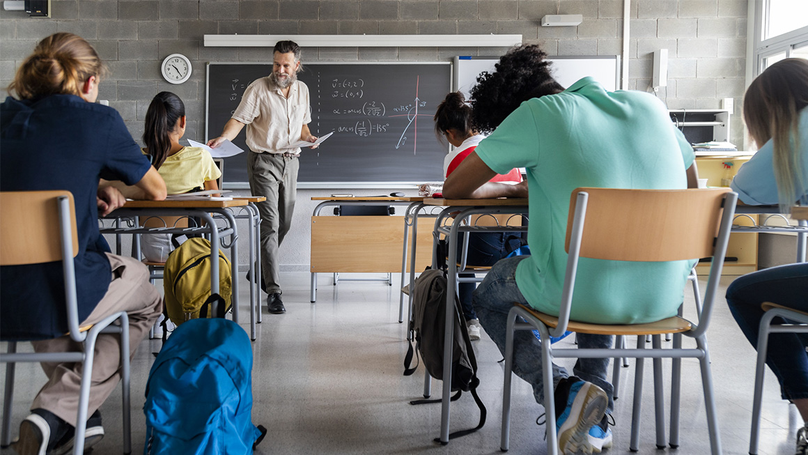 kids sitting in a classroom. 