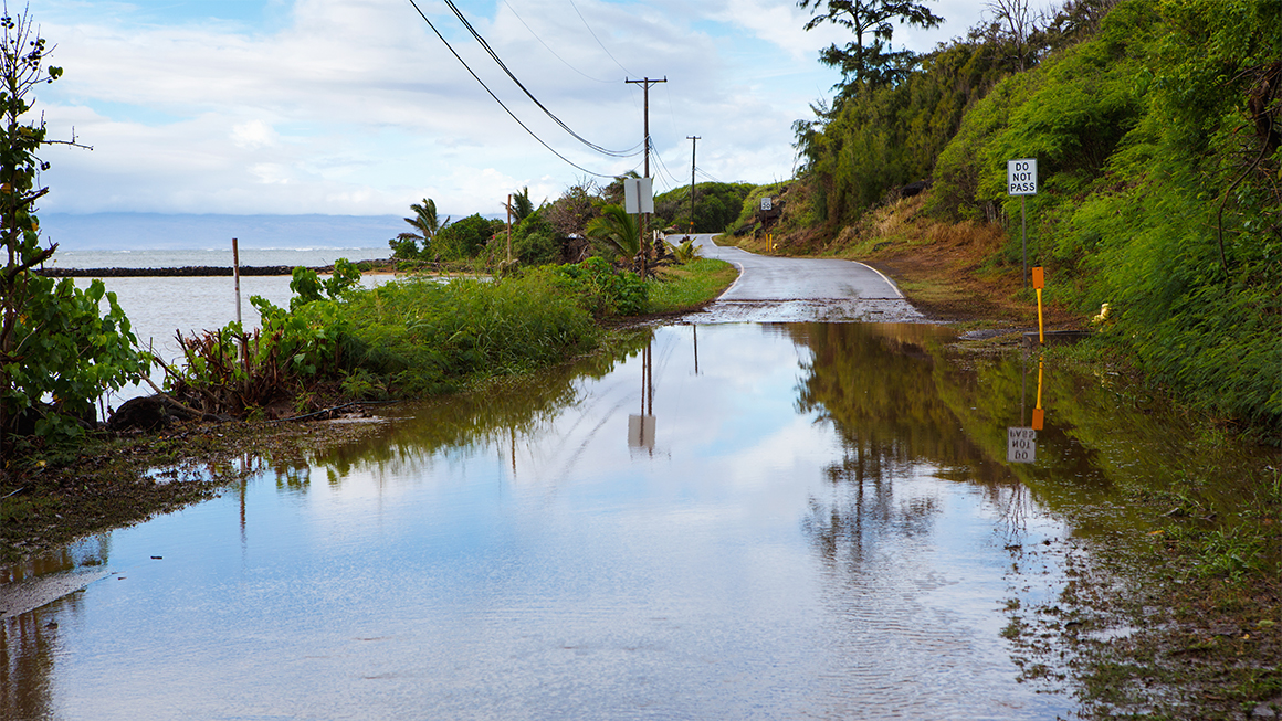 Image of a flooded coastal road in Hawaii.