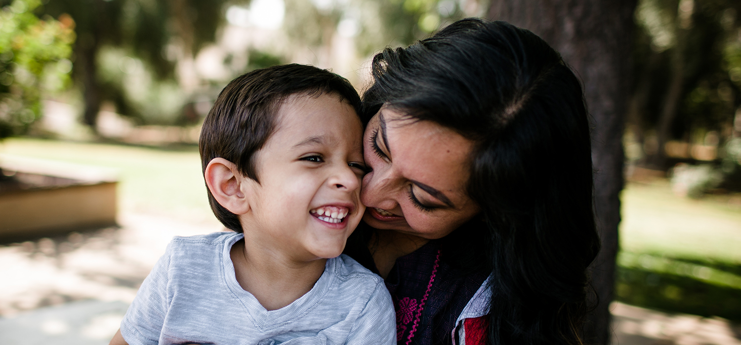 A mother holds her son