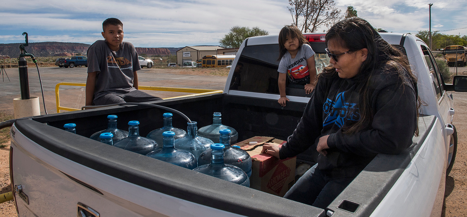 Family collects water for their home in the Navajo Nation