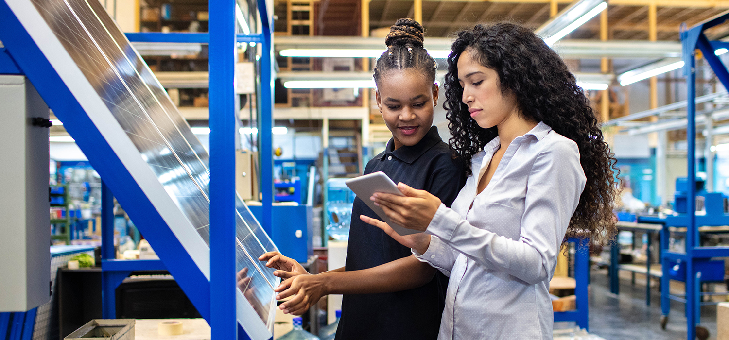 Women work together in a factory