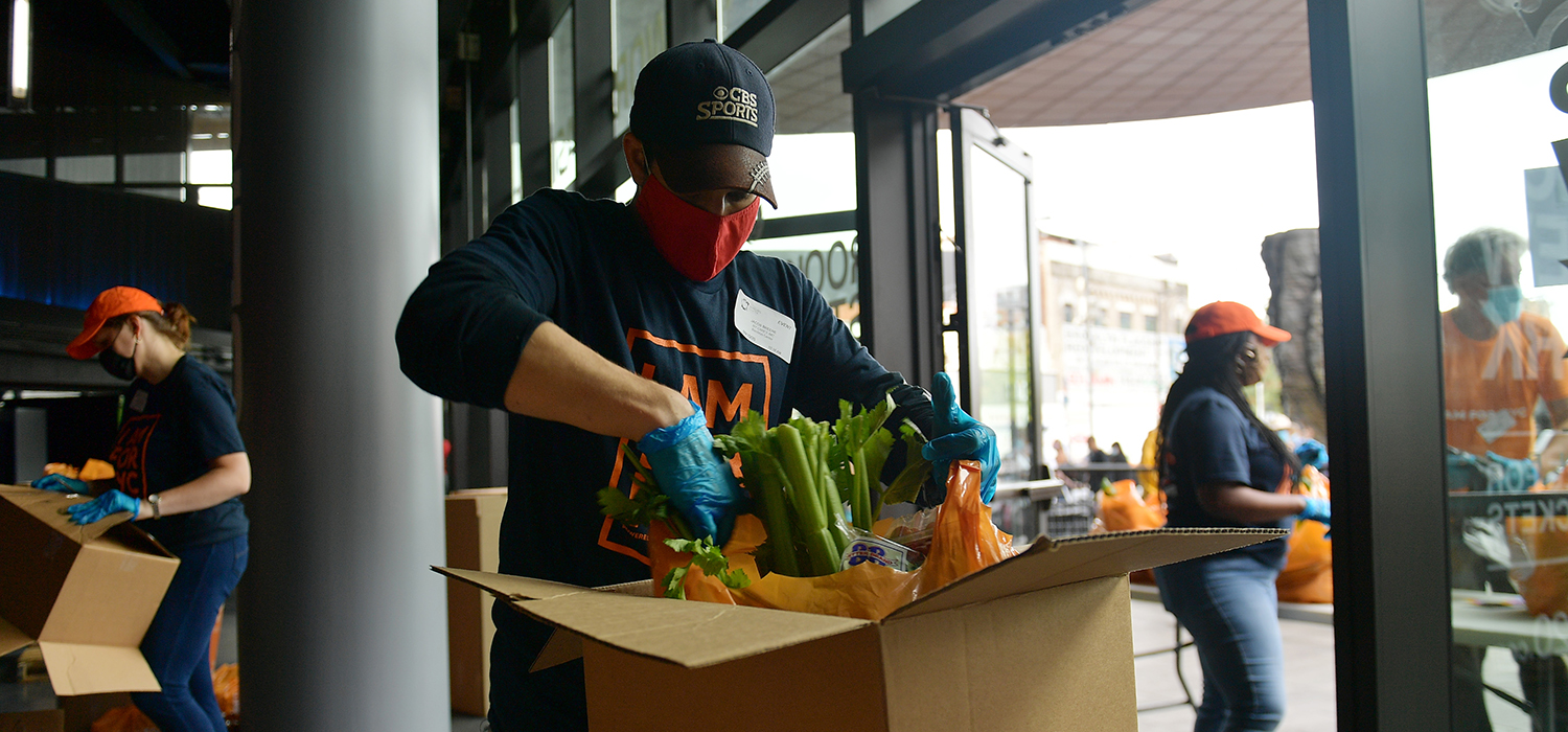 Worker prepares a food box