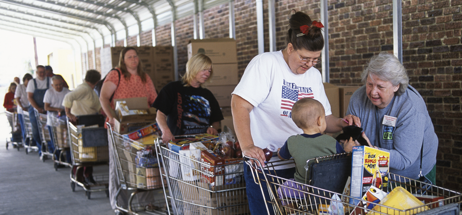 People stand in line at the grocery store