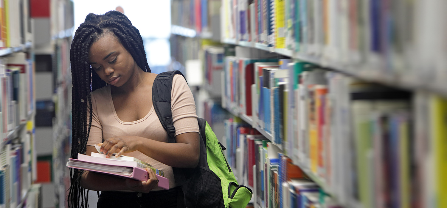 Student walks in library