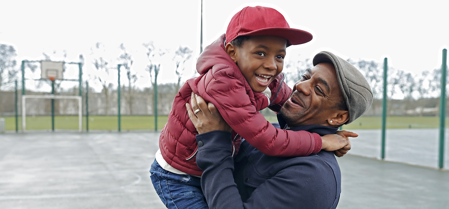 A man and child play together