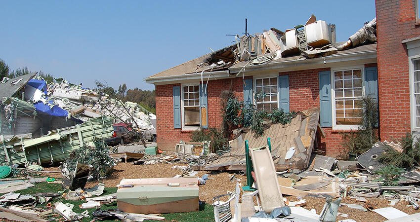 A single family home that has significant damage on the exterior. 