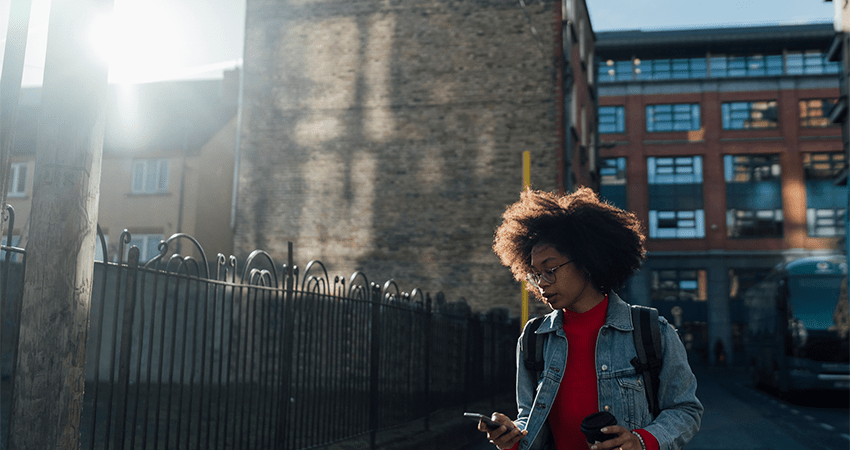 Woman walking in front of a building