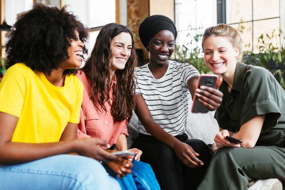 photo of women sitting together
