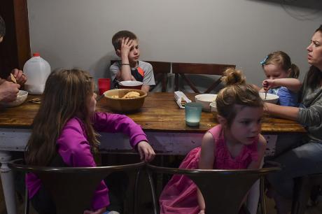 A family around the dinner table.