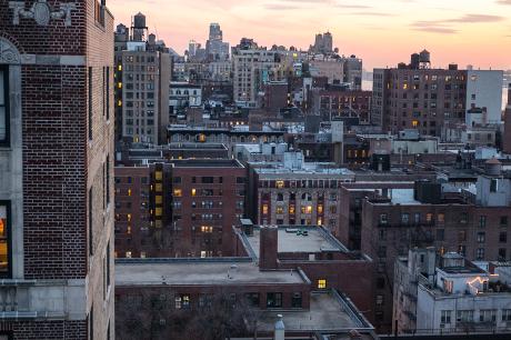 Wide shot of city buildings.