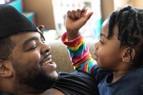Mo Major plays with his daughter Marley