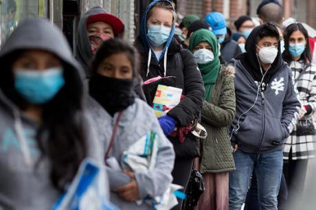 Long line of people wearing mask