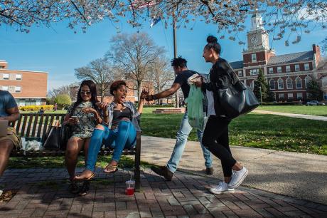 Students socialize between classes on the Yard.
