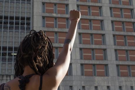 Women with hand up in protest 
