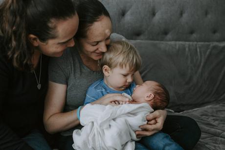 parents holding their children