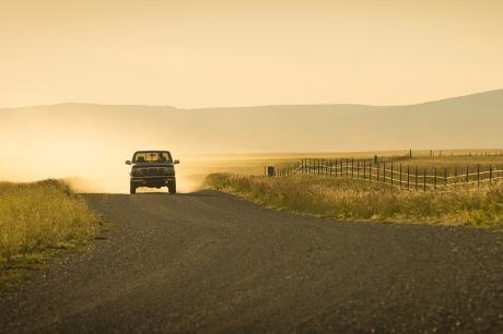 Car driving on a backroad