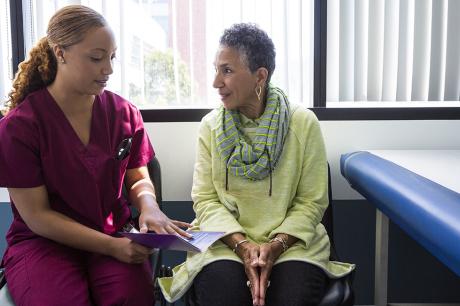 Health care worker talking with a patient