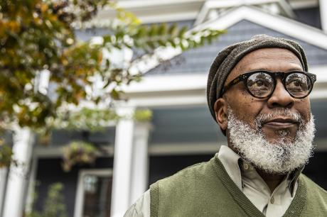 Man in front of a house