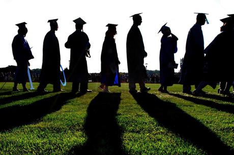 Group of student in graduation gowns. 