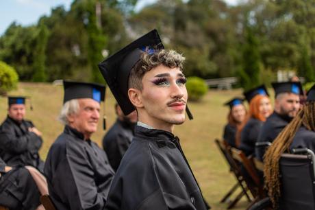 A student at a graduation ceremony. 