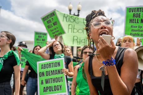 Abortion rights demonstrator Elizabeth White leads a chant in response to the Dobbs v Jackson Women’s Health Organization ruling in front of the U.S. Supreme Court.
