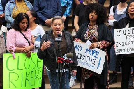 Protestors holidng signs. 