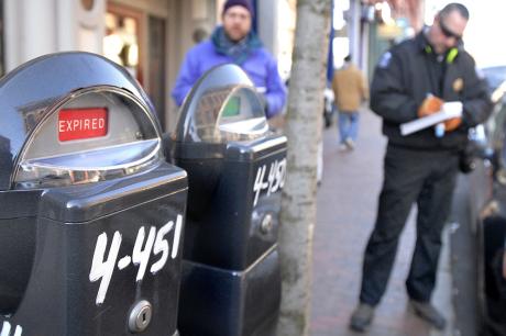 Reporter Ray Routhier follows Portland Parking Control Officer Chad Jones as he writes out a ticket during his rounds in the Old Port. 