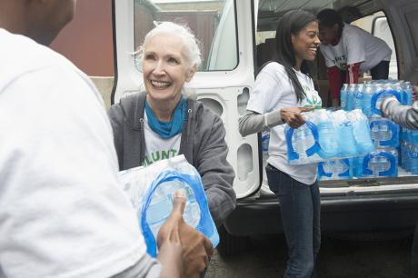 Volunteers handing out water bottles. 
