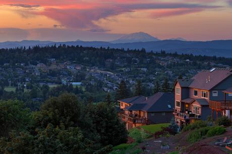 A wide shot of a neighborhood at sunset. 