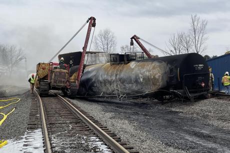 A rail road train derailed off it's track.