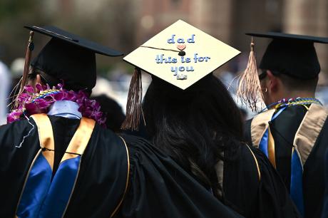 Students wearing academic regalia attend their graduation ceremony at the University of California Los Angeles (UCLA