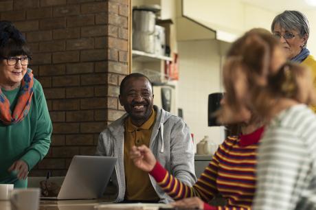 A group of people sitting around a table. 
