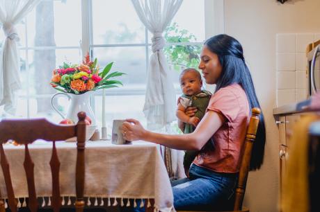 A woman and child at the kitchen table