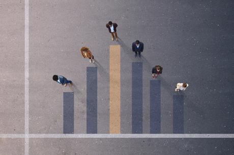 Aerial shot of people in a formation mimicking a graph.