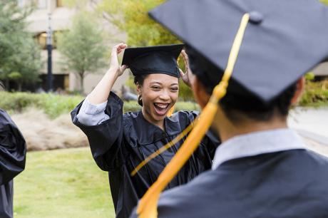 A college graduate outside. 