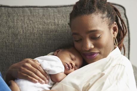 Mom holds her baby
