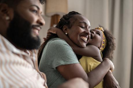 A mother holding her child. 