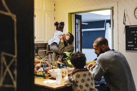 A family at their kitchen island.