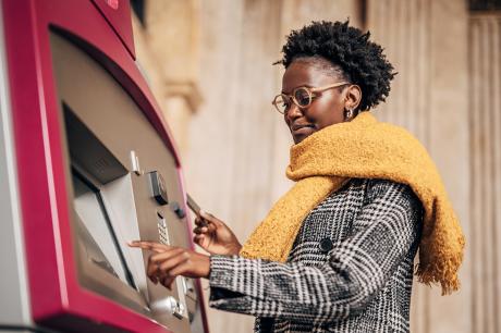 A woman at an ATM.