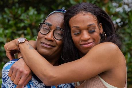 Trophi and Steger hug outside of Muffin's Place.