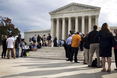 People line up outside of the Supreme Court in Washington.