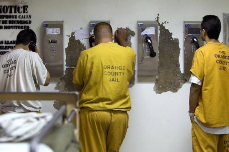 Inmates make collect phone calls at the Sheriff's Central Men's Jail in 2011