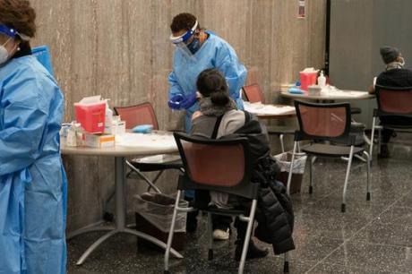 people getting vaccinated at a community health clinic