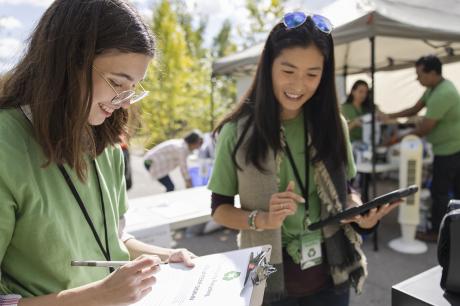 Two young women volunteering.