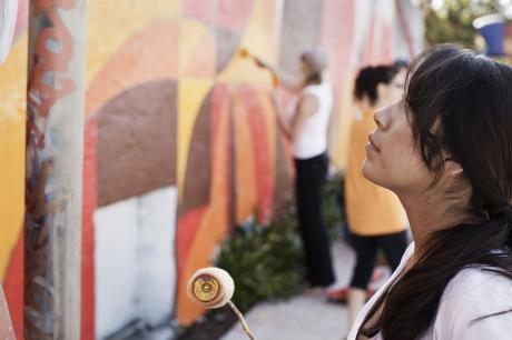 Woman paint art on wall
