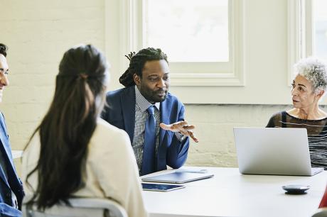 A group of workers during an office meeting.