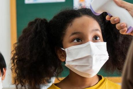 photo of kids wearing masks at school