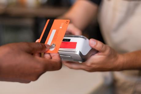 Someone paying with a credit card.