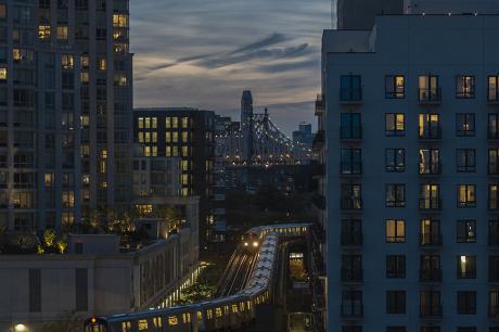 Tall city buildings at nightime.